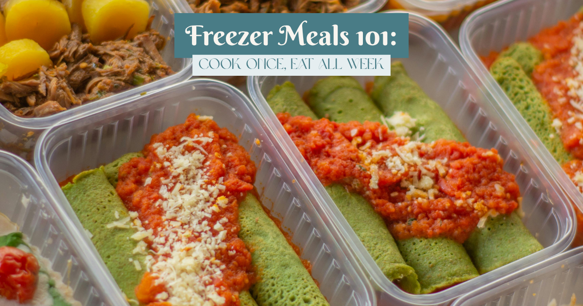 Overhead view of healthy meal prep containers filled with colorful homemade dishes, ready for freezing or storing for the week.